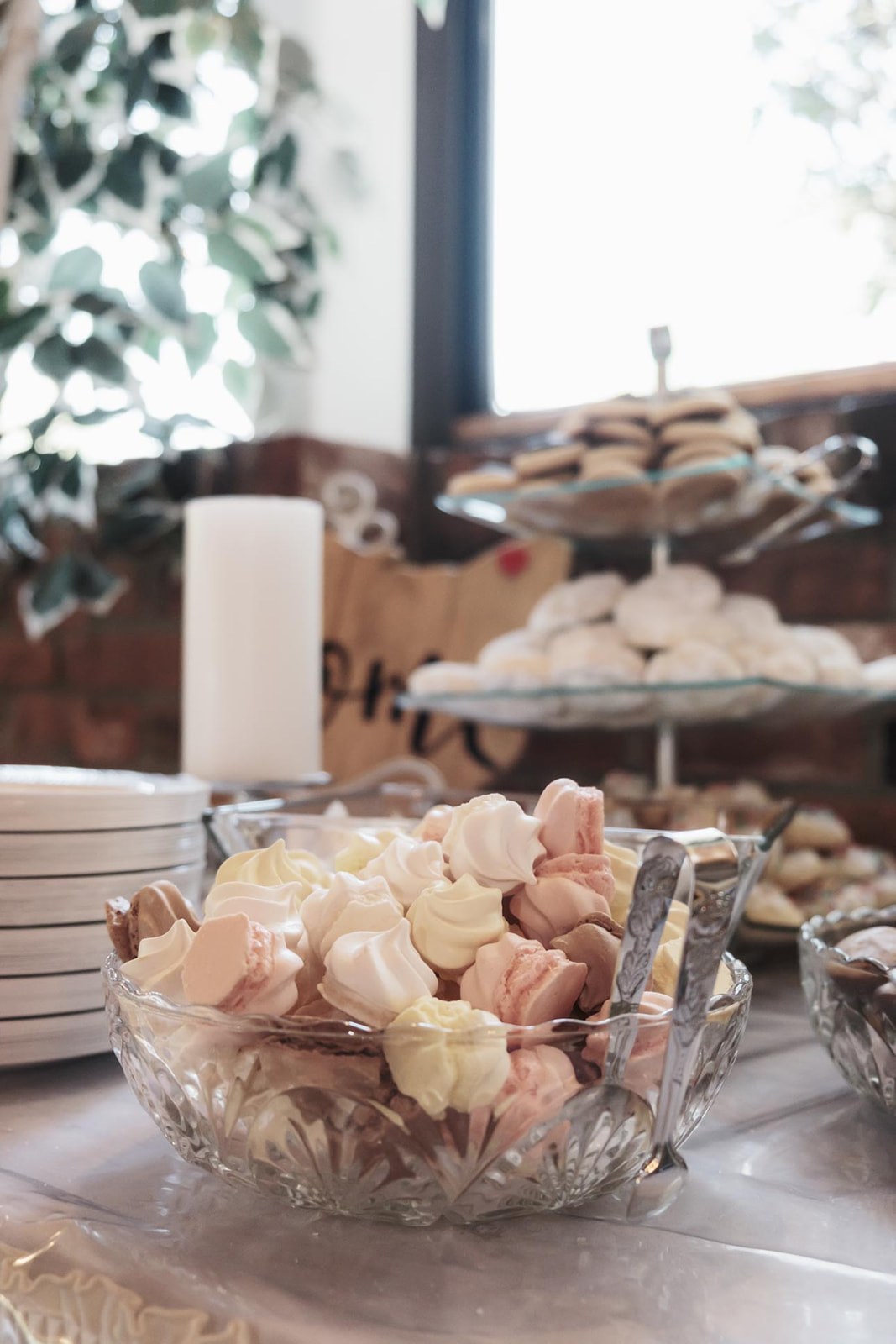Pastel cookies displayed in a glass bowl